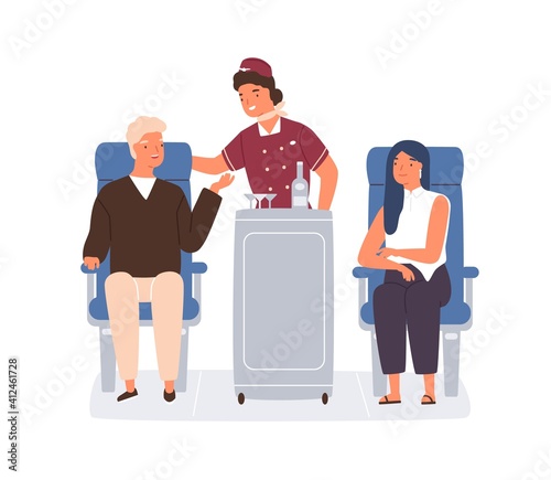 Friendly stewardess rolling trolley and serving passengers in plane. Man orde...