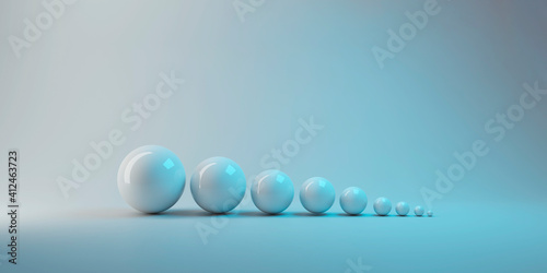 3d rendering. simple white small to big sphere ball object on gray background. growing up or evolution concept. photo
