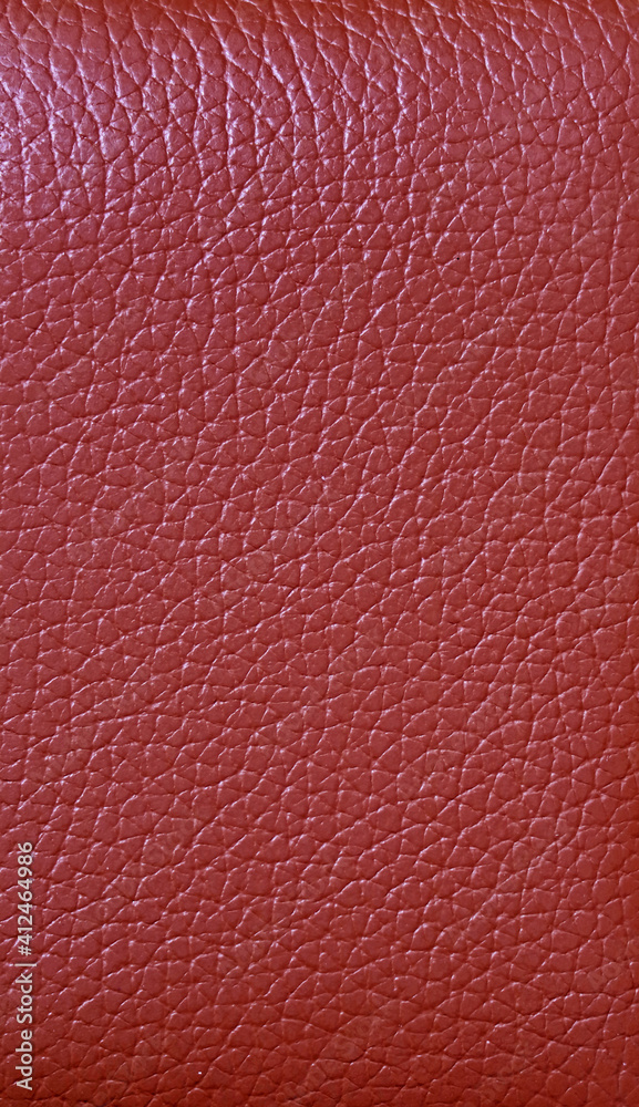 Texture of crimson red colored cow leather surface for abstract background Texture of crimson red colored cow leather surface for abstract background