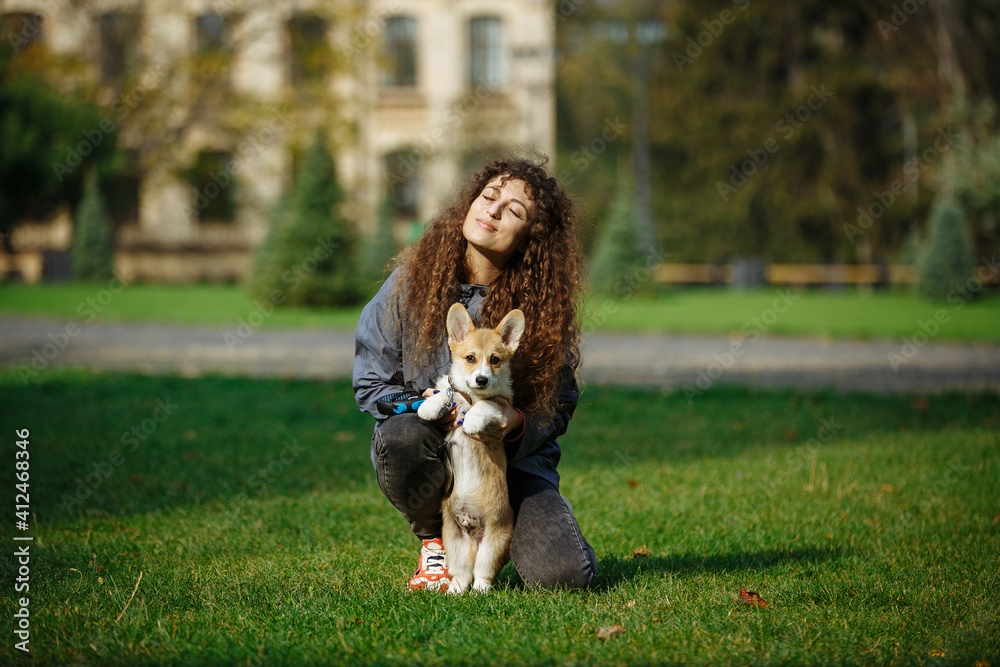 girl plays and hugs with her puppy girl plays and hugs with her puppy