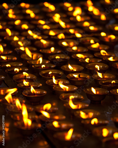 Burning candles in Buddhist temple. McLeod Ganj, Himachal Prades