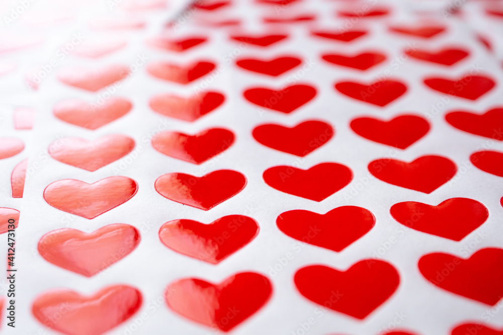Close up red heart sticker on white paper Close up red heart sticker on white paper