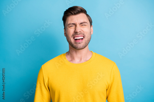 Portrait of satisfied person laughing loud look camera have great time isolated on blue color background
