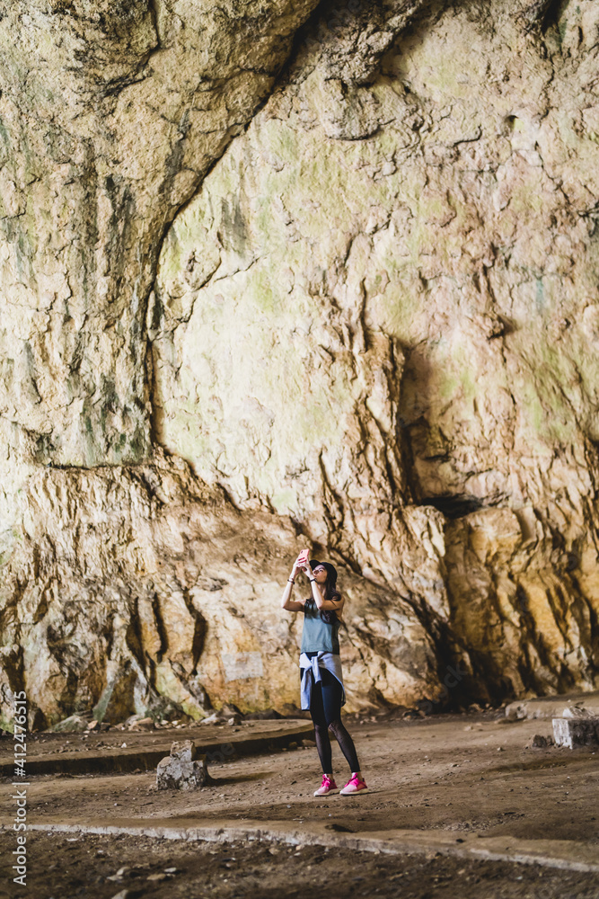 Famous place ,eastern europe traveler girl exploration a devetashka cave near Lovech