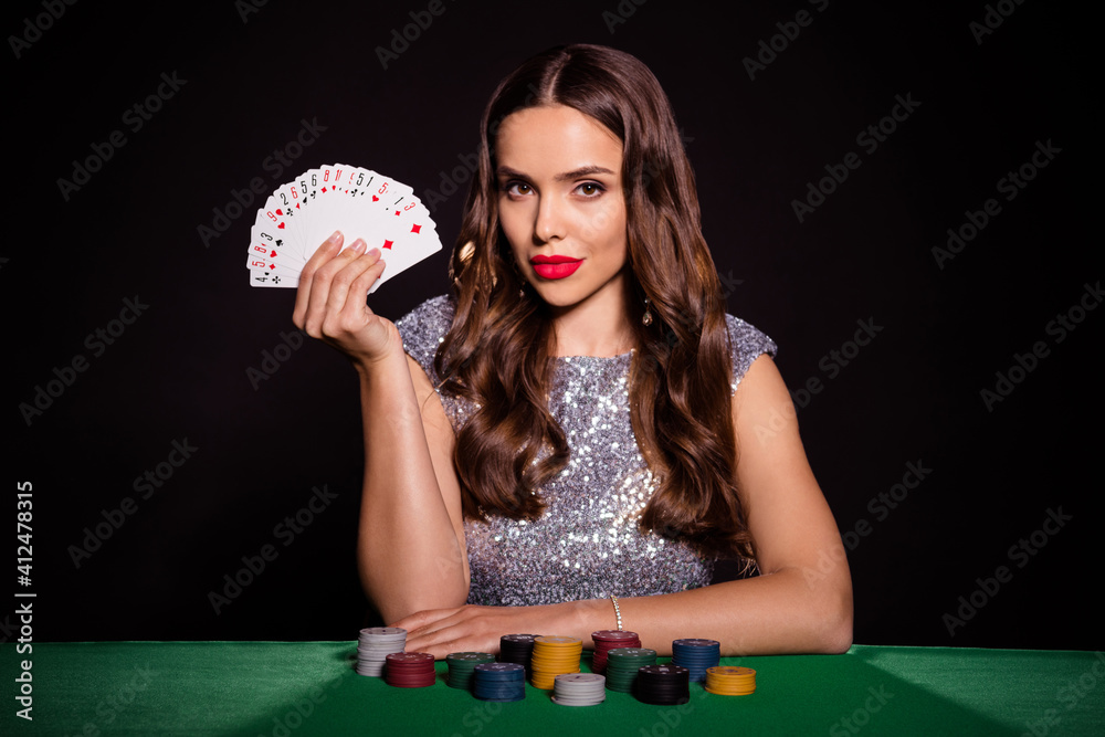 Photo of pretty lady sit poker table demonstrate fan cards wear glossy  dress isolated black color background Stock Photo | Adobe Stock