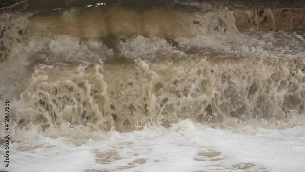 Close shot of dirty water flowing in a river Close shot of dirty water flowing in a river