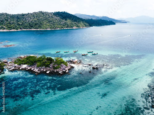 Aerial view of the long tail boats on tropical sea satun, Thailand ,Island and coral
