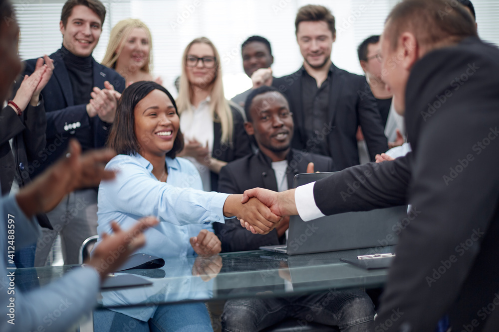 Handshake business people afher effective negotiation with clien Handshake business people afher effective negotiation with clien
