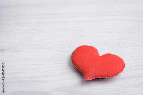 Background for Valentine's Day greeting card.Valentines day concept.Red hearts on a wooden background.