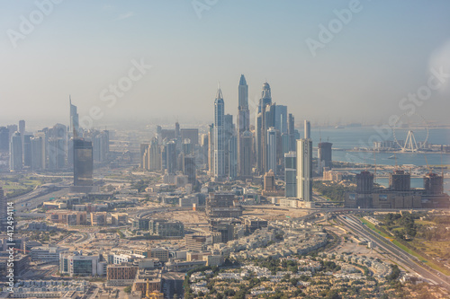 DUBAI, UAE - December, 2020: Aerial city view from helicopter. Dubai is a fast advancing metropolis.