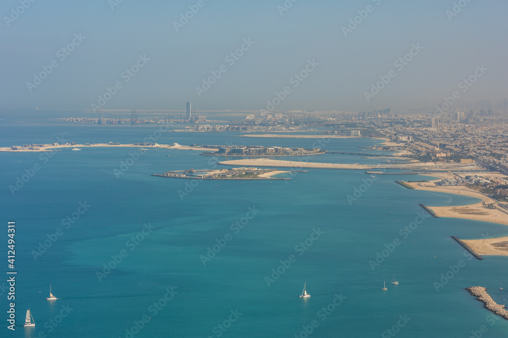 DUBAI, UAE - December, 2020: Aerial city view from helicopter. Dubai is a fast advancing metropolis.