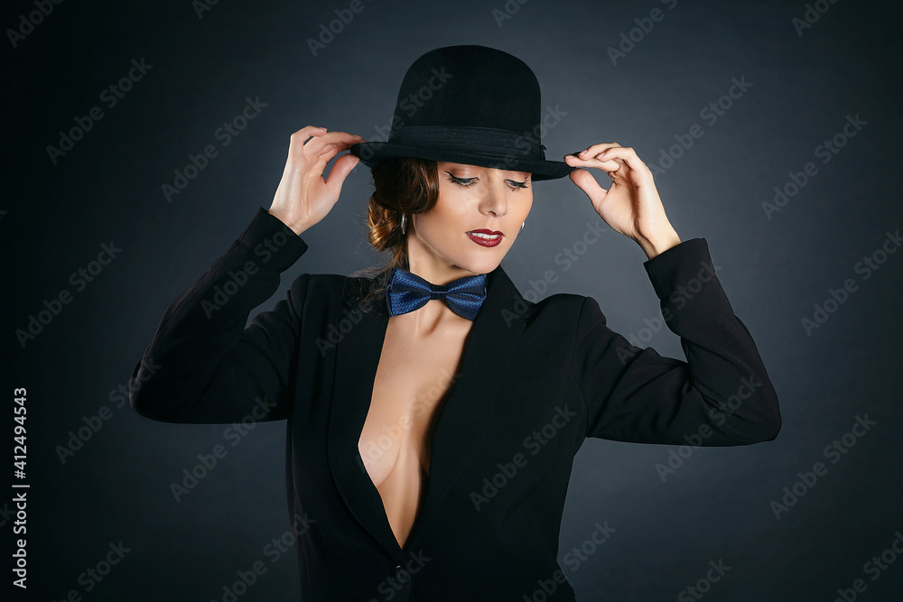 curvy young woman in a man's suit and a fedora curvy young woman in a man's suit and a fedora