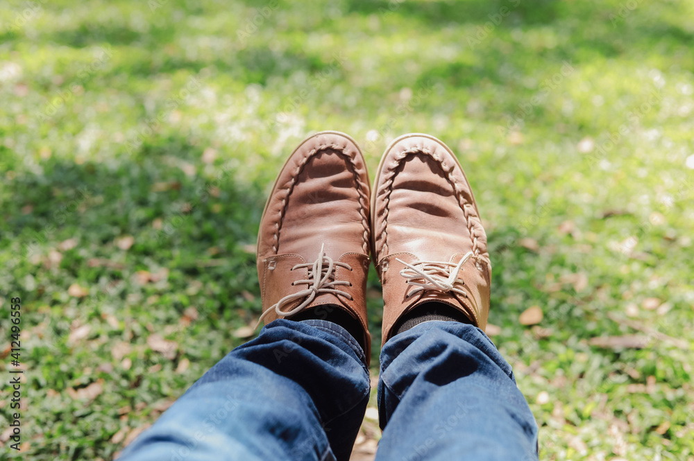 Men's legs wearing leather shoes