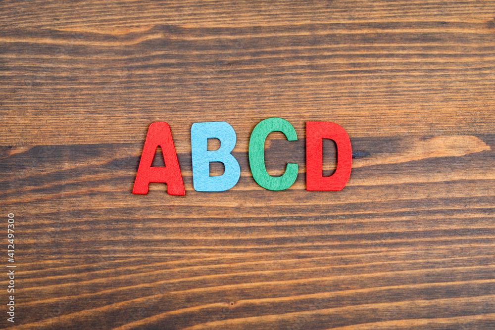 Fototapeta premium ABCD, education and science concept. Colorful letters of the wooden alphabet
