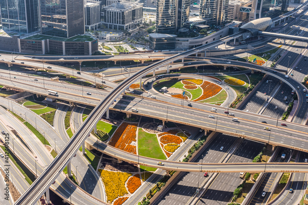Naklejka premium DUBAI, UAE - December, 2020: Dubai skyline with beautiful city close to it's busiest highway on traffic