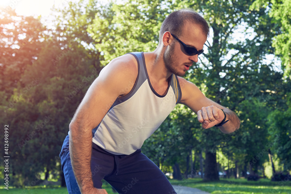 Sporty young adult man training in the park. Sporty young adult man training in the park.