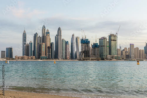 DUBAI, UAE - December, 2020: Skyscrapers and jumeirah beach in Dubai Marina. UAE