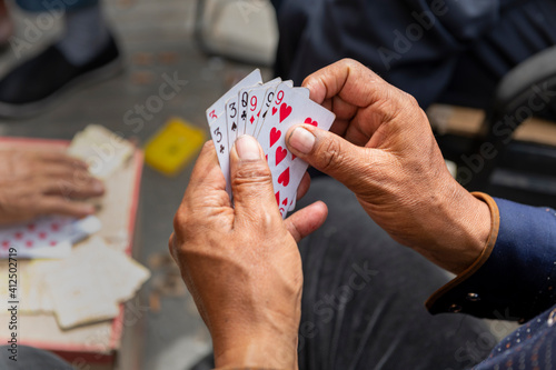 People Playing Card on the street, Qilian County, Qinghai Province, China