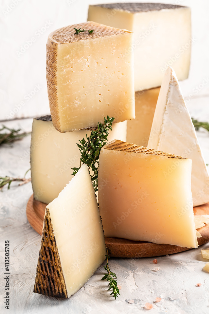 Cheese board of various types of soft and hard cheese. spanish manchego