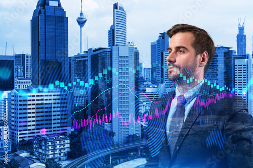 Photography A young Caucasian handsome trader and stock market analyst in suit dreaming about market behavior and forecast in crisis
