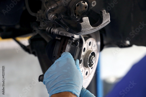 Brake pad replacement in car service