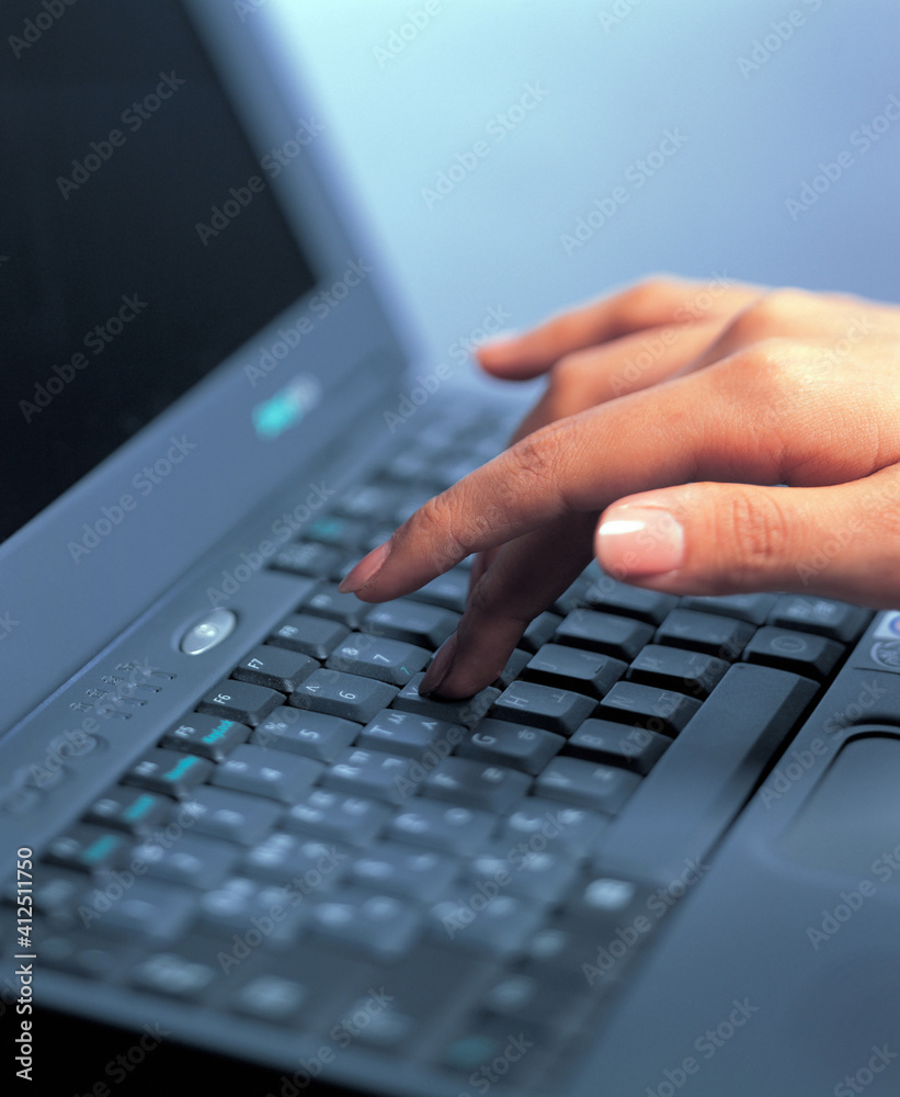 person typing on a laptop person typing on a laptop