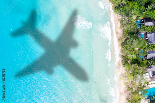 Travel traveling vacation sea symbolic picture airplane flying copyspace copy space Seychelles beach water