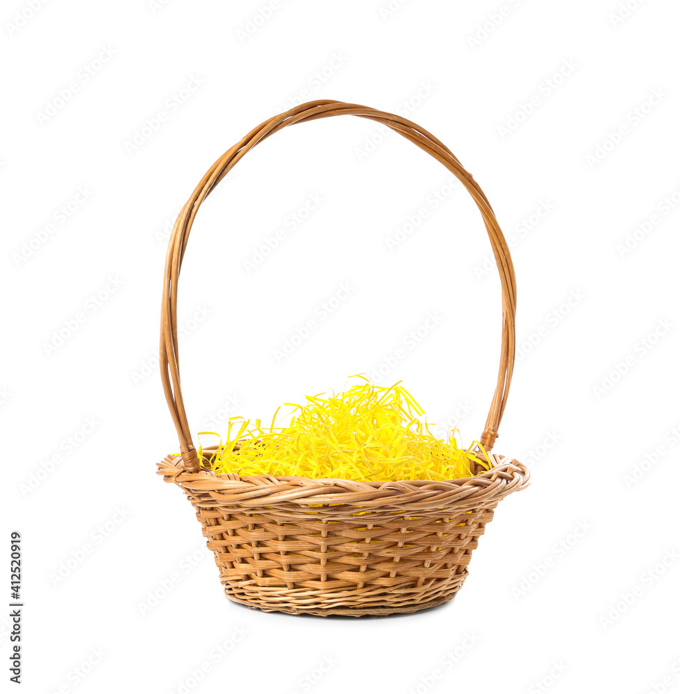 Wicker basket with yellow filler isolated on white. Easter item Wicker basket with yellow filler isolated on white. Easter item
