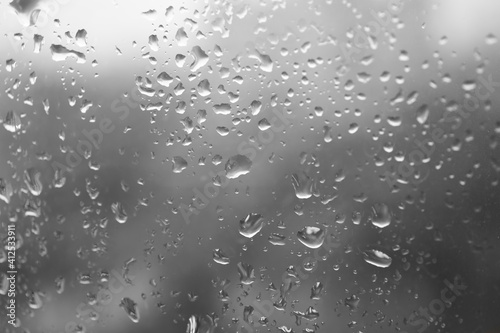 Water drops on window glass, closeup view