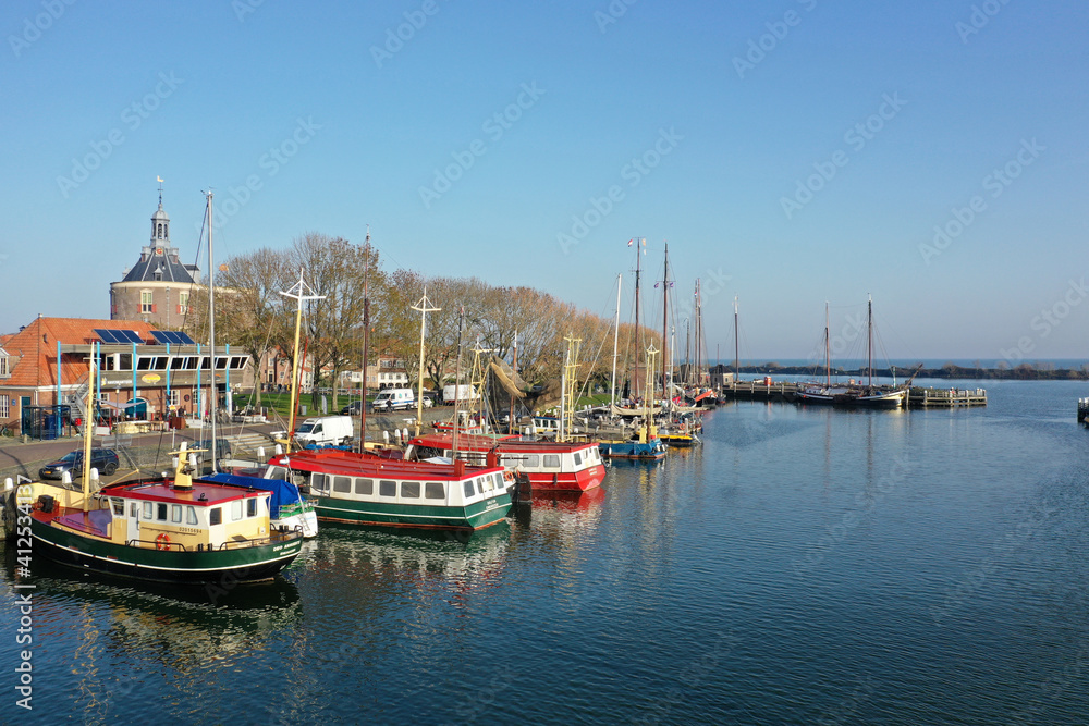 Drone photo of the harbor of Enkhuizen with colored fishing boats