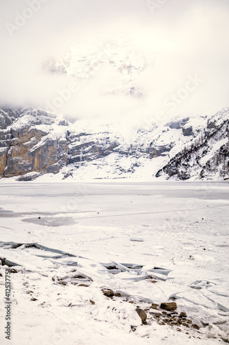 Wallpaper Mural Frozen lake with broken edge in a snowy mountain landscape Torontodigital.ca
