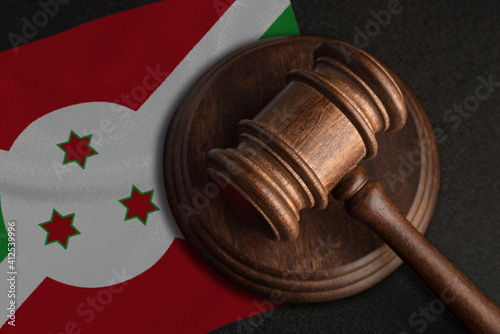 Judge gavel and flag of Burundi. Law and justice in Burundi. Violation of rights and freedoms photo