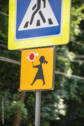 Traffic sign Attention children. Signpost. Girl with candy.. Vertical frame