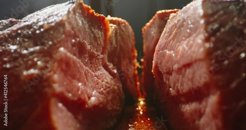 Big piece of roasted steak, tasty meat cut. Macro shot of grilled steak on chefs preparation table, 4k footage.