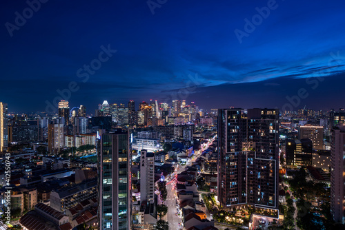 Wide panorama of Singapore cityscape at magic hour.