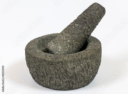 Canvas Print Stone mortar and pestle on a white background