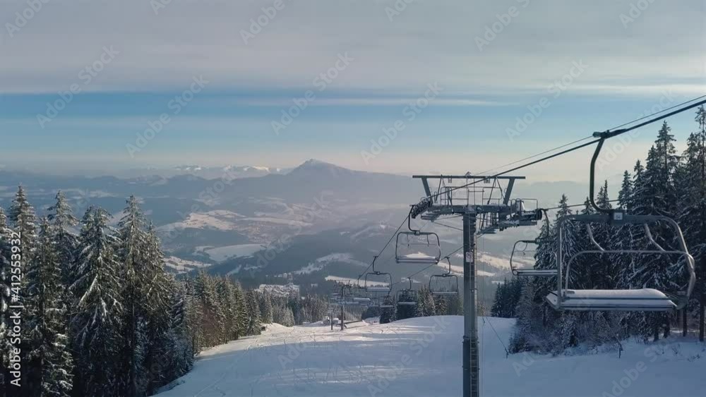 Empty chairlift in closed ski resort due to coronavirus in beautiful sunny winter season in alpine mountains Empty chairlift in closed ski resort due to coronavirus in beautiful sunny winter season in alpine mountains