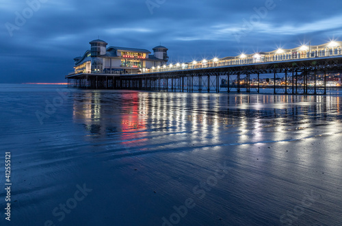 Long Exposure Image Of Weston-super-Mare Pier With Reflected Lights On The Wet Sand © Peter Greenway