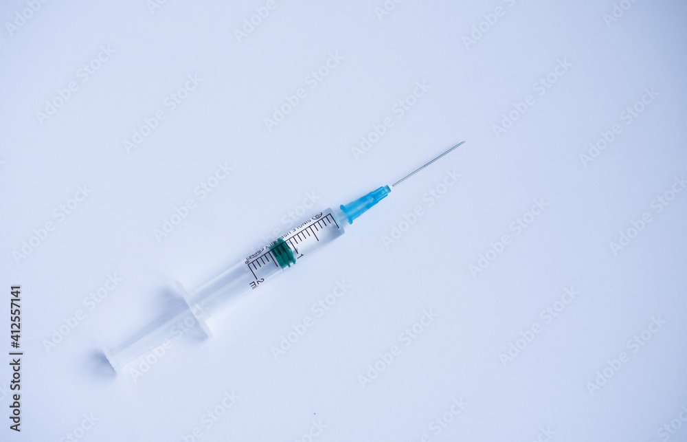 open disposable syringe on white background with free copy space, disposable syringe for vaccination or injection open disposable syringe on white background with free copy space, disposable syringe for vaccination or injection