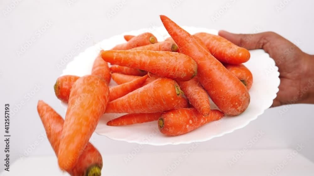View of a white plate filled with fresh carrots, Fresh carrots in a plate