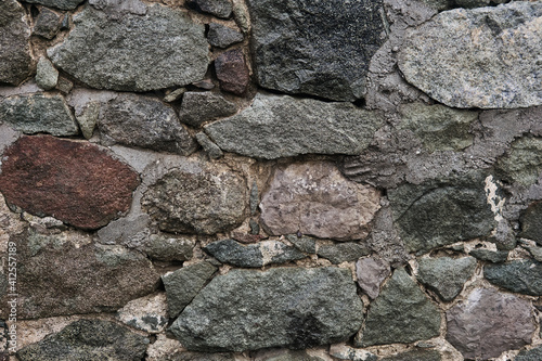 background, texture - ancient masonry at the base of the castle