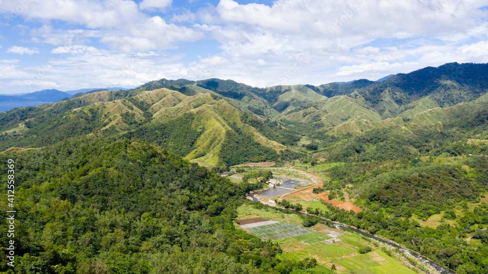 Beautiful mountain landscape on Luzon island, Philippines. Mountains and green hills in clear weather. Cordillera region, top view.