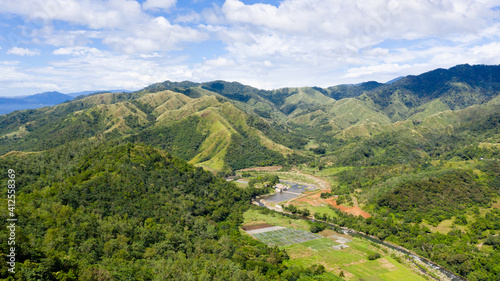 Beautiful mountain landscape on Luzon island  Philippines. Mountains and green hills in clear weather. Cordillera region  top view.