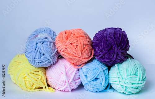 colorful yarn, thread on white background, materials for knitting and sewing