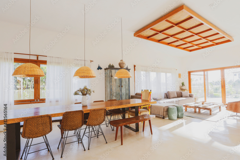 Modern summer holiday or vacation wooden beach house living room interior with rustic luxury sofas, tables and decoration. Modern summer holiday or vacation wooden beach house living room interior with rustic luxury sofas, tables and decoration.