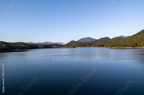 The beautiful and vast autumn scenery of Hoe-dong dam in Busan, South Korea. © J. studio