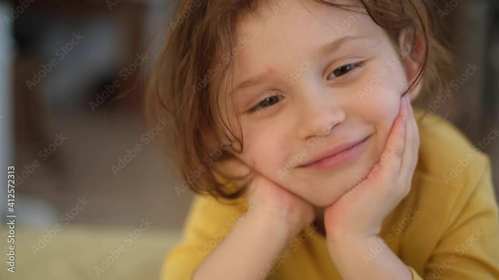 Little baby girl face home portrait close up happy child looking camera Little baby girl face home portrait close up happy child looking camera