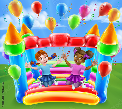 Children jumping and bouncing on a kids bouncy inflatable castle house