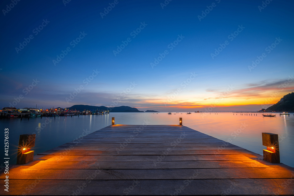 beautiful paradise sunset view over wood bridge harbor bay for speed boat in island near Pattaya Thailand relax location for travel in summer during sunset over the sea in Thailand, South East Asia