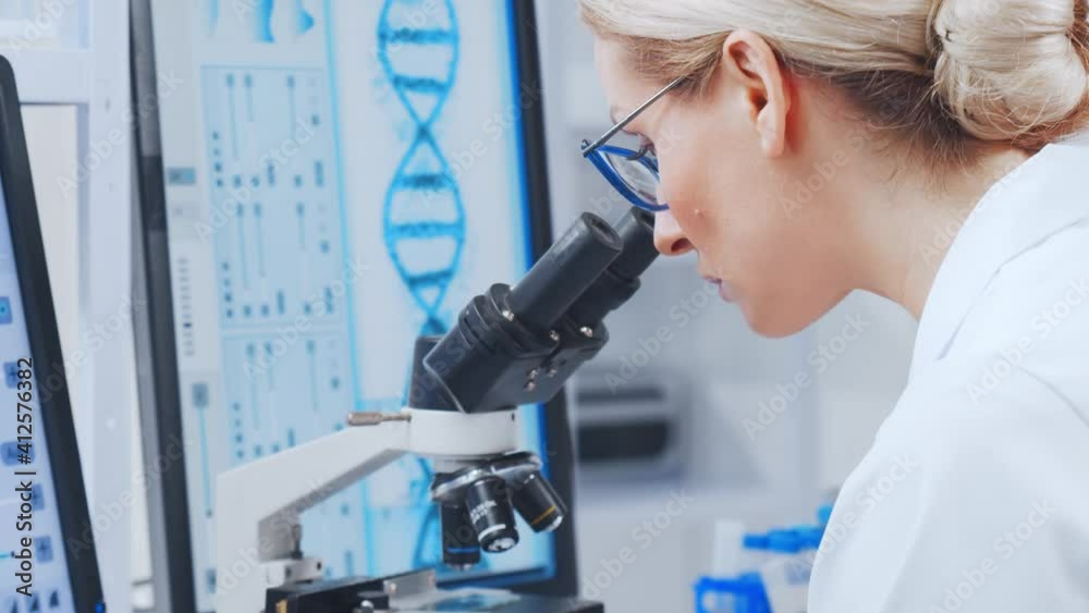 Professional team of scientists is working on a vaccine in a modern scientific research laboratory. Genetic engineer workplace. Future technology and science. Professional team of scientists is working on a vaccine in a modern scientific research laboratory. Genetic engineer workplace. Future technology and science.